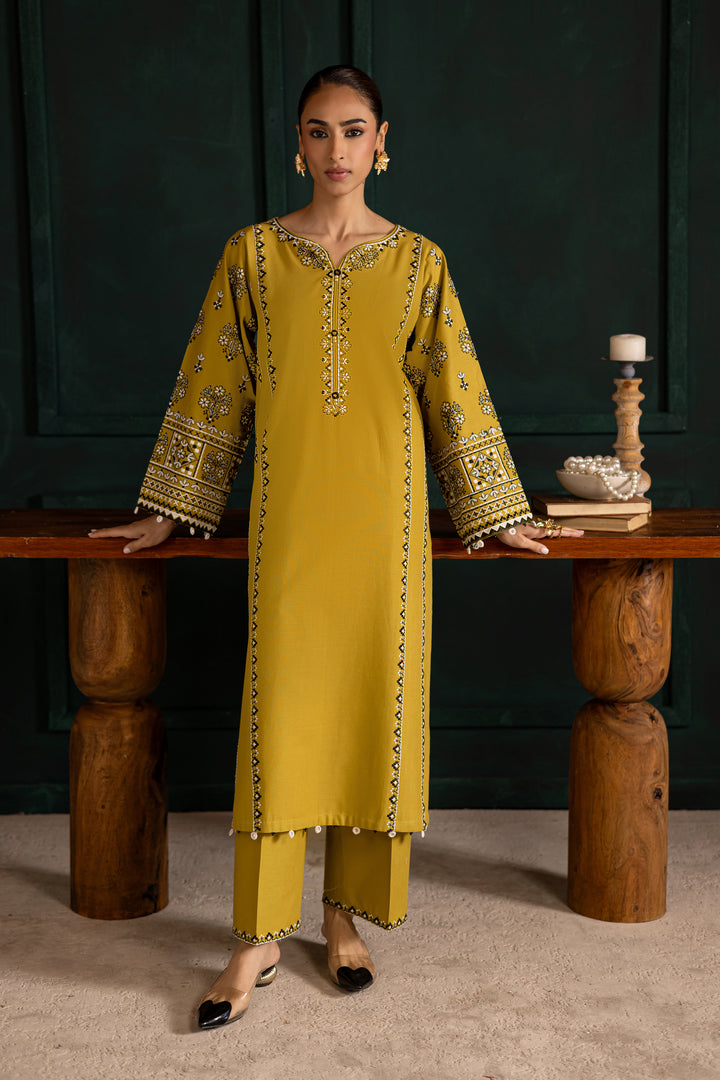 Batik Kantha two piece khaddar set featuring an embroidered lemon green paneled shirt with mirror work and bead detailing. Affordable ethnic Pakistani South Asian.