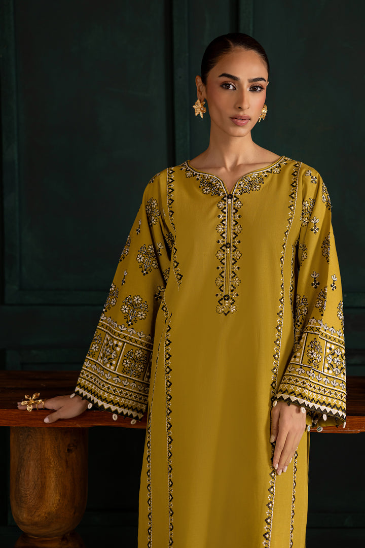 Embroidered lemon green khaddar shirt by Batik adorned with intricate mirror work on the sleeves. Affordable ethnic Pakistani South Asian.