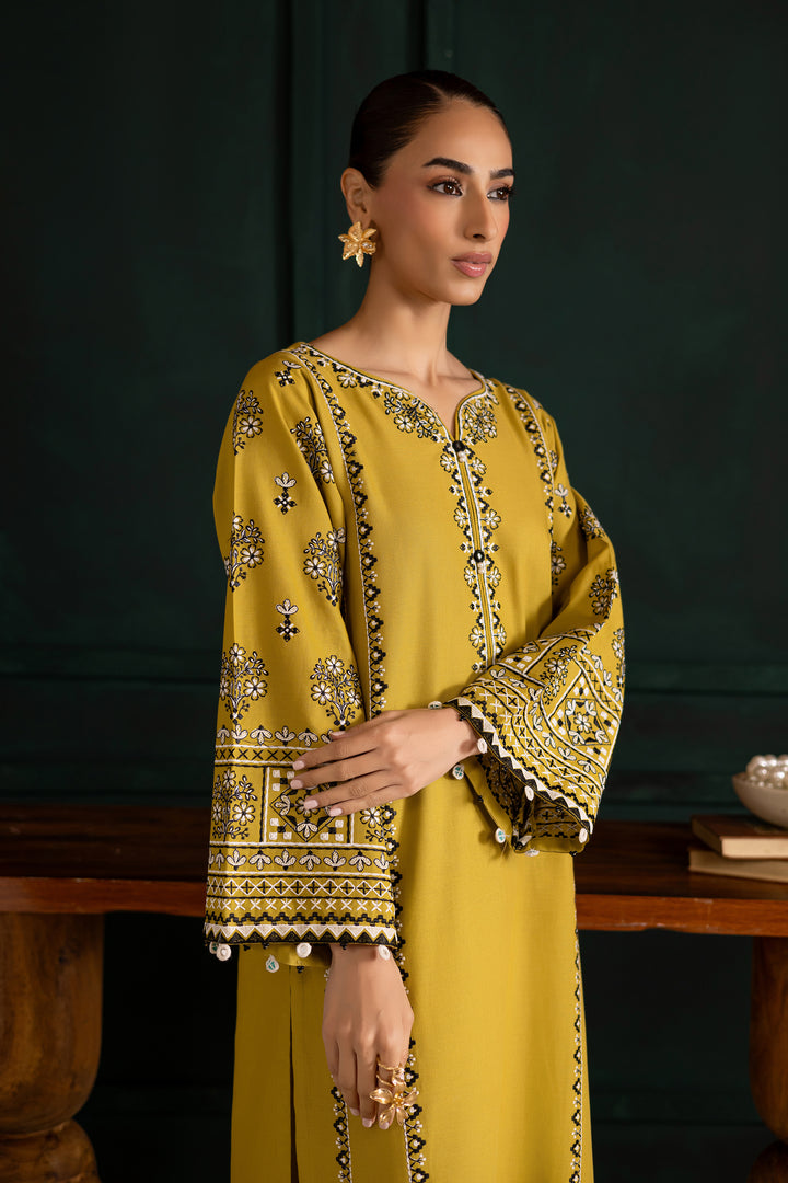 Embroidered lemon green khaddar shirt by Batik adorned with intricate mirror work on the sleeves. Affordable ethnic Pakistani South Asian.