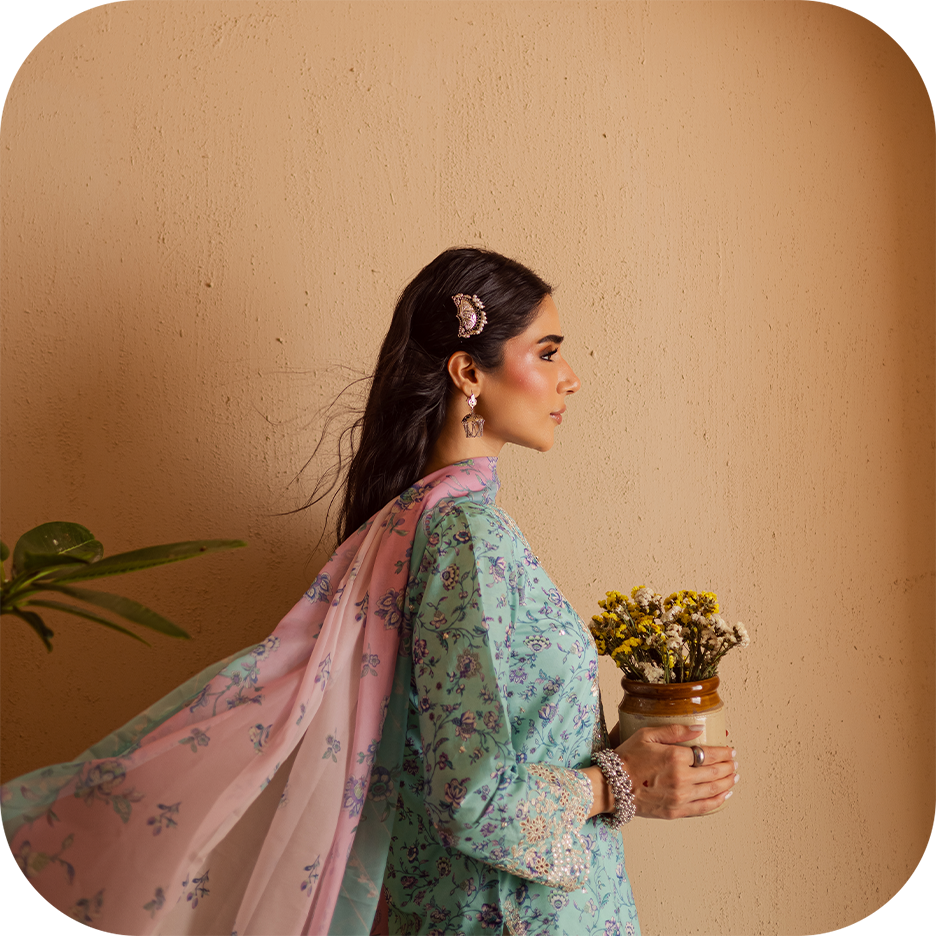 Woman wearing BATIK festive print dress for Eid 2025