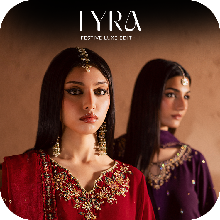 A Pakistani woman dressed in BATIK’s Lyra Luxe Pret, glowing under warm lights in elegant festive georgette.